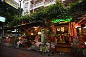 Tourists relaxing in a hotel bar, Banglamphu, Bangkok, Thailand