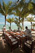 Waiters setting the table in a beach restaurant, Mae Nam Beach, Hat Mae Nam, Ko Samui, Thailand