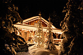 Illuminated log cabin, Alberta, Canada