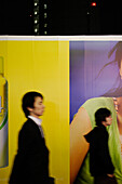 Young people in front of a fashion billboard, Harajuku, Takeshita-Dori, Tokyo, Japan