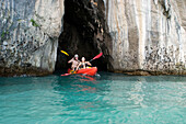 Couple kayaking, Ko Hong Island lagoon, Phang Nga bay, Krabi, Thailand, after the tsunami