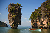 View to Koh Tapu, so-called James Bond Island, The Man with the Golden Gun, people in a longtail boat in foreground, Ko Khao Phing Kan, Phang-Nga Bay, Ao Phang Nga Nation Park, Phang Nga, Thailand