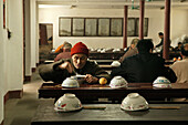 Monks eating at the canteen of the monastery, Heng Shan South, Hunan province, China, Asia