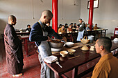 Mealtime and prayer, monastery dining hall, Fawang Monastery, Taoist Buddhist mountain, Song Shan, Henan province, China