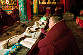 Prayer ceremony in Pusa Ding monastery, yellow cap monks, Wutai Shan, Five Terrace Mountain, Buddhist Centre, town of Taihuai, Shanxi province, China