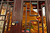 Temple Buddha behind locked doors, China, Asia