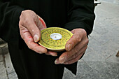 Chinese Feng Shui compass, a Lopan, in hands of Fengshui master, China, Asia