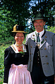 young couple in traditional dresses, pilgrimage to Raiten, Schleching, Chiemgau, Upper Bavaria, Bavaria, Germany