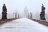 Charles Bridge in the snow, looking east to the Old Town, Prague, Czech Republic