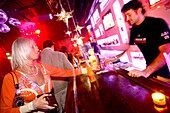 Woman ordering a drink, Club Radost, New Town, Nove Mesto, Prague, Czech Republic