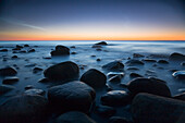 A rocky sea shore at dusk, Jasmund national park, Rugen Island, Mecklenburg Western Pommerania, Germany
