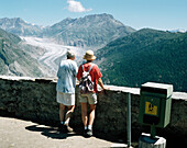 Tourists looking at the Aletsch Glacier, Switzerland