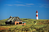 Thatched House house in the dunes and List East lighthouse, List, Sylt, Schleswig Holstein, Germany