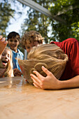 Boy's head in a dish with water, children's birthday party
