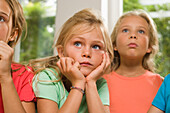 Three girls keeping tabs on something, children's birthday party