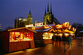 People strolling over Christmas market in cathedral square in the evening, Erfurt, Thruriniga, Germany