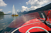 A motor boat and sailing boat near St. Gilgen, Lake Wolfgangsee, Salzburg, Austria