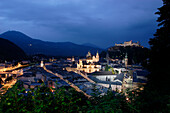 View of Salzburg old town at night from Museum der Moderne, with fortress Hohensalzburg in the background, Salzburg, Austria