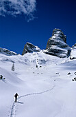 Back country skier ascending Corno d'Angolo, Cristallo Range, Dolomites, South Tyrol, Italy