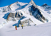 Two people skiing, Monte Rosa, Zermatt, Valais, Switzerland, Europe