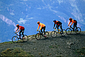 Four people on a mountainbike tour, Arosa, Grisons, Switzerland, Europe