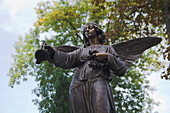 A bronze sculpture of an angel at a cemetary in Allgaeu, Upper Bavaria, Bavaria, Germany