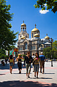Tourists in front of Chram Sveta Uspenie Bogorodicno Cathedral in Varna, Bulgaria, Europe