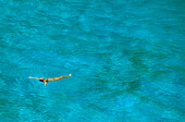 Woman swimming in bay, Cala S'Amonia, Mallorca, Balearic Islands, Spain