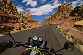 Driving BMW motorbike through Long Canyon, Utah, USA