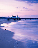 View over beach with pier in sunset, Ahlbeck, Usedom, Mecklenburg-Western Pomerania, Germany