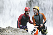A man canyoning, talking to guide, Hachleschlucht, Haiming, Tyrol, Austria