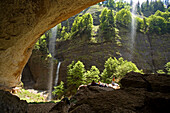 Hikers resting near grotto, Ofenloch gorge, Canton St. Gallen, Switzerland