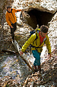 Canyon hike Ofenloch, canton St. Gallen, Switzerland, two men cross the creek Necker . Ofenloch, Schwaegalp, canton St. Gallen, East Switzerland, Alps, Europe, MR