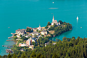 Aerial shot of Maria Woerth and the Woerthersee, the largest lake in Carinthia, Carinthia, Austria