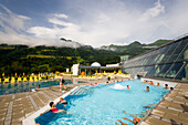 People bathing in a thermal outdoor pool, Alpen Therme Gastein, Bad Hofgastein, Gastein Valley, Salzburg, Austria