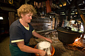 Anna Gruber kneading the cheese, traditional cheese production, Karseggalm (1603 m, one of the oldest mountain hut in the valley), Grossarl Valley, Salzburg, Austria