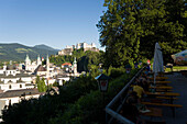 View from terrace of the restaurant Stadtalm over old town with Hohensalzburg Fortress, largest, fully-preserved fortress in central Europe, Salzburg Cathedral, Franciscan Church and St. Peter's Archabbey, Salzburg, Salzburg, Austria, Since 1996 historic 
