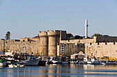 View over Emboria harbour to Thalassini Gate (sea gate, built 1502) entrance form Emborio harbour to mediaeval old town, Rhodes Town, Rhodes, Greece, (Since 1988 part of the UNESCO World Heritage Site)