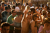 Young people dancing on sunday party at Sundance Beach Bar, young couple greeting at camera, Gennadi beach, Gennadi, Rhodes, Greece