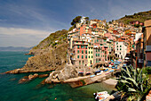View over bay with marina to Riomaggiore, Cinque Terre, Liguria, Italy