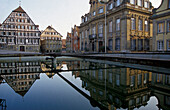 Mirroring of houses on water surface, marketplace, Schwaebisch Hall, Baden-Wuerttemberg, Germany