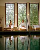 Woman with child at the pool, Badescheune, spa area of Seehotel Neuklostersee, Mecklenburg-Western Pomerania, Germany
