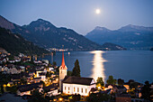 Parish church St. Maria, Weggis and Lake Lucerne in the moonlight, Canton Lucerne, Switzerland
