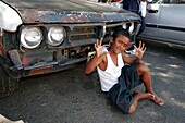 Boy in front of old car, Bo Kaap, Cape Town, South Africa