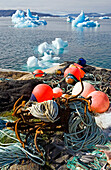 Icebergs and tools for fishery at the coast of Narsaq, South Greenland.