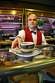 waiter in Cafe, red waistcoat, Valencia, Spanien