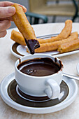 fried sweet breakfast pastry, Churros and hot chocolate