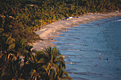 Coast showing sandy beach and palm trees, Playa la ropa, Zihuatanejo, Guerrero, Mexico, America