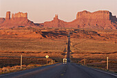 A caravan on the highway, Monument Valley, Arizona, USA