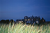 View of an old mansion in the evening at Cobo Bay, Guernsey, Channel Islands, Great Britain